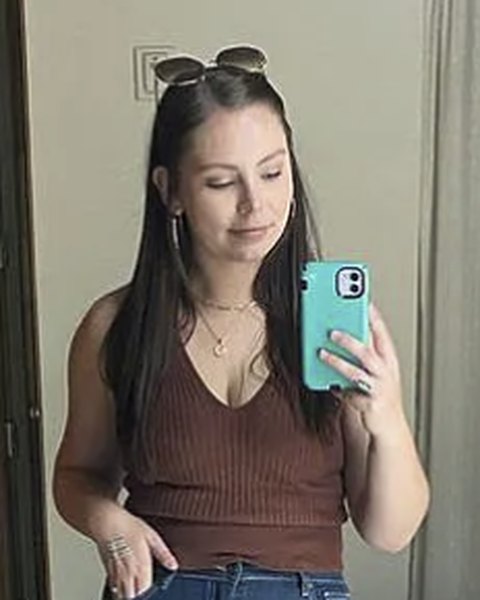 Andrea G. in a brown knit tank top