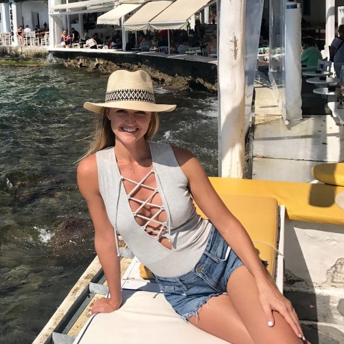 Merissa M. by the sea in a lace-up bodysuit
